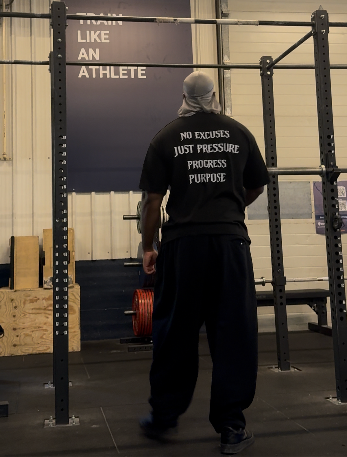 Strap-Up Fitness Pressure Tee back print worn in the gym
