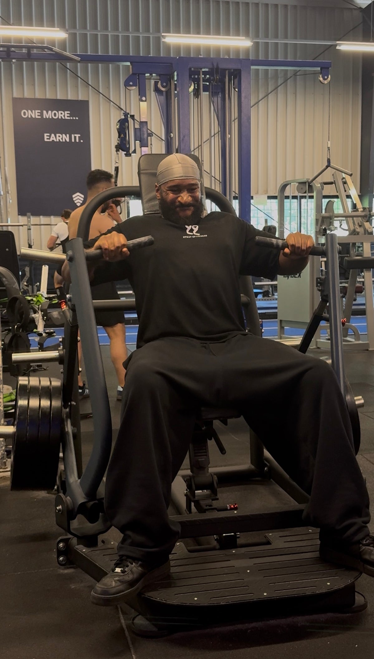 Strap-Up Fitness Pressure Tee worn during strength training in the gym
